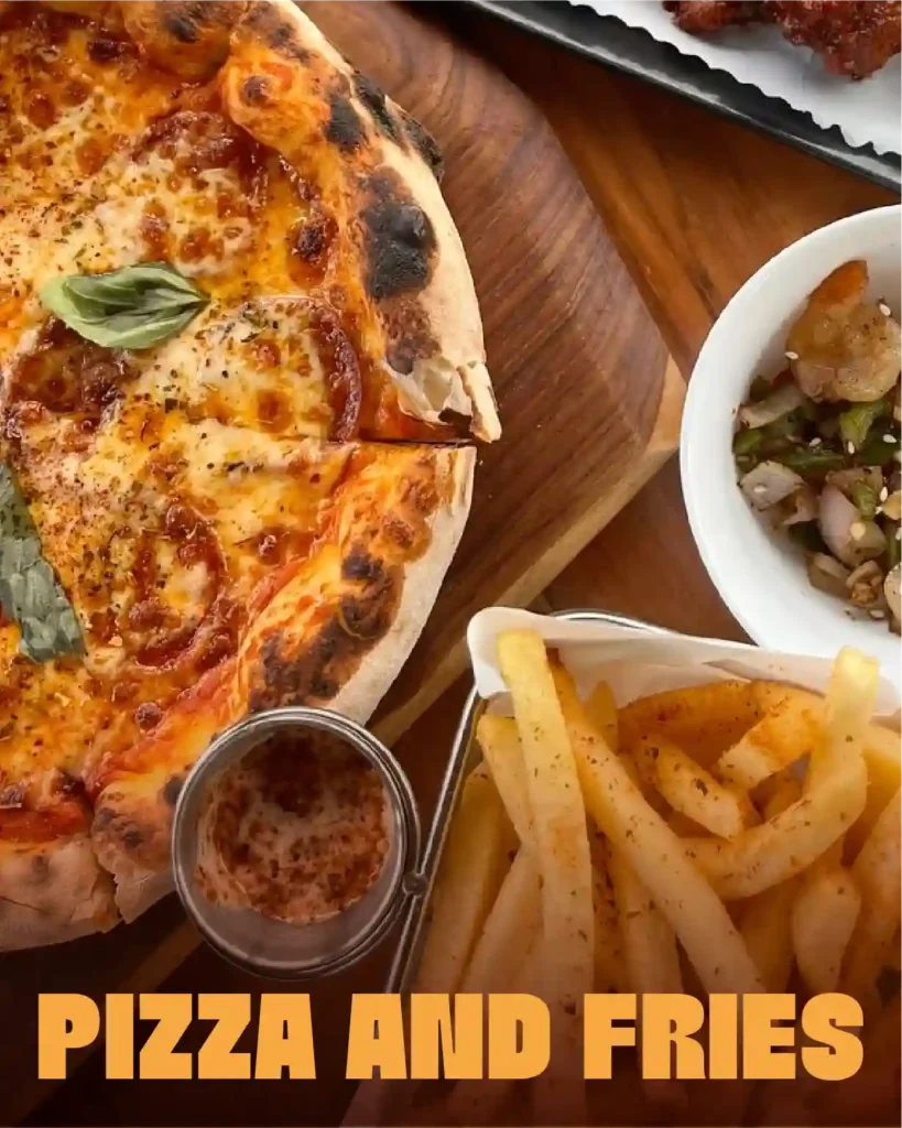 Pizza and fries served with dipping sauce